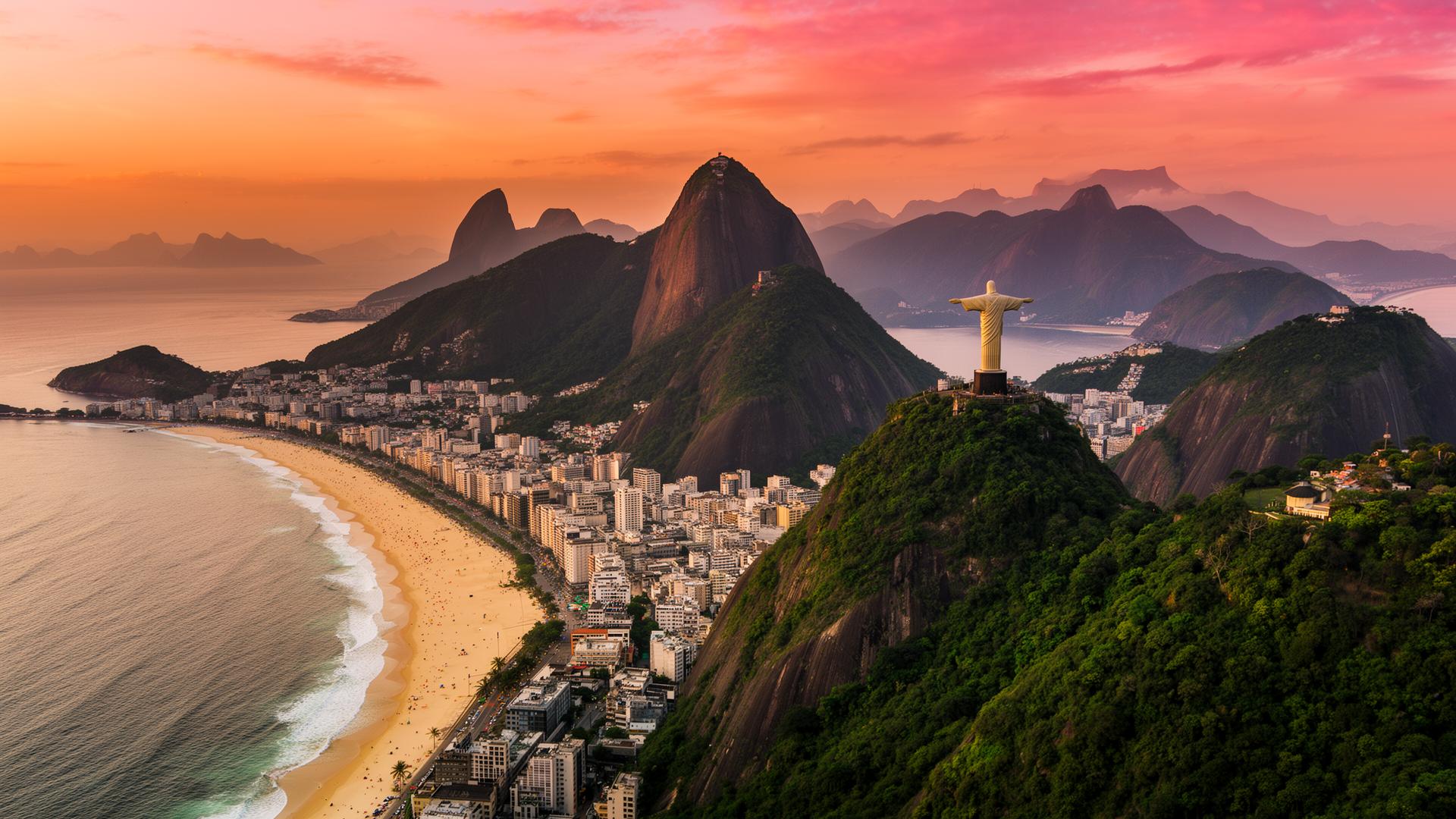 Aerial view of Rio de Janeiro coastline and mountains at sunset